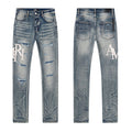 AMIRI Light Blue Distressed Letter Graphic Jeans