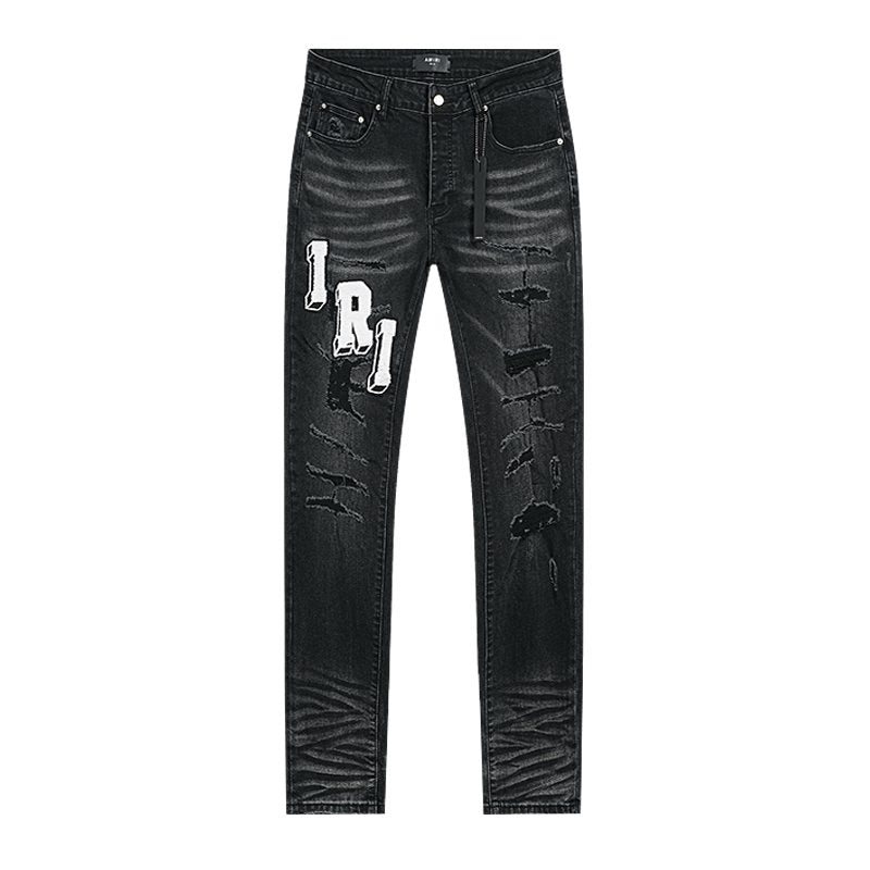 AMIRI Varsity Letter Appliqué Distressed Jeans